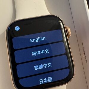 Apple Smartwatch with Gold Case and White Band